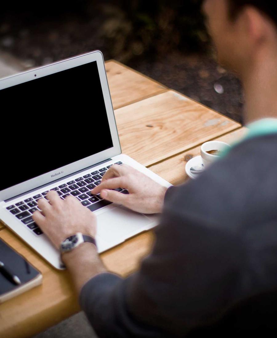 Working on a laptop during a marketing and app development project